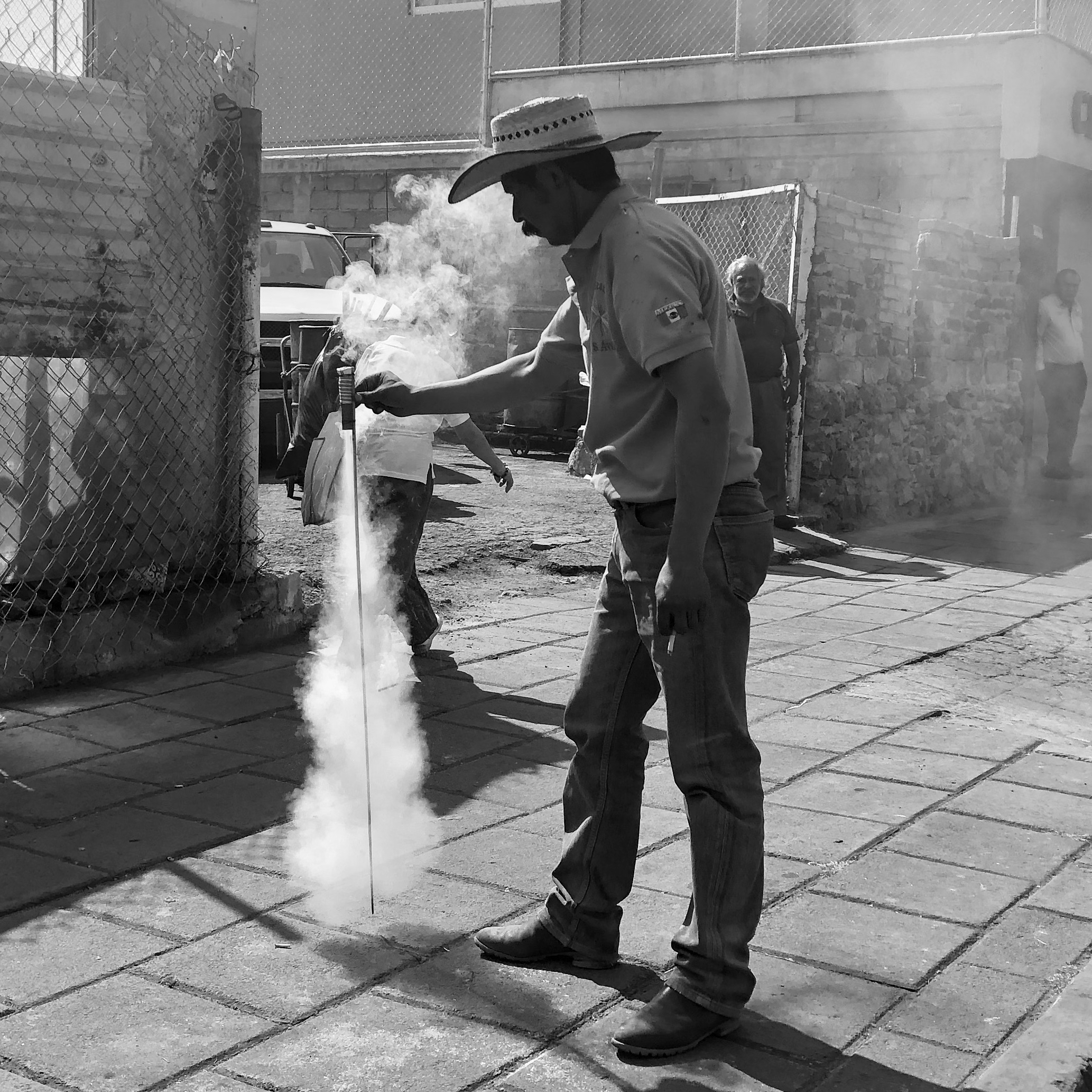 A street vendor sets off cohetes, or small, rocket-like fireworks, during the Candlemas parade in Xochimilco Feb. 2, 2019.